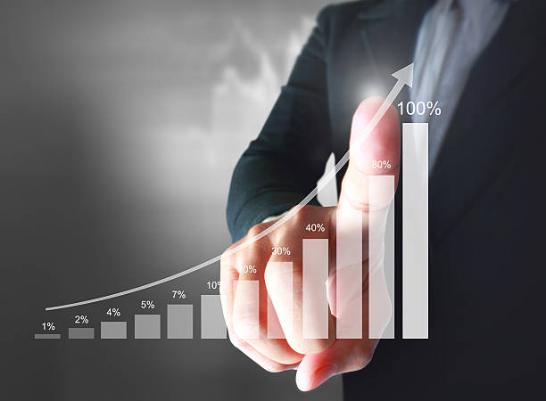 istock Businessman with financial symbols coming 518112604