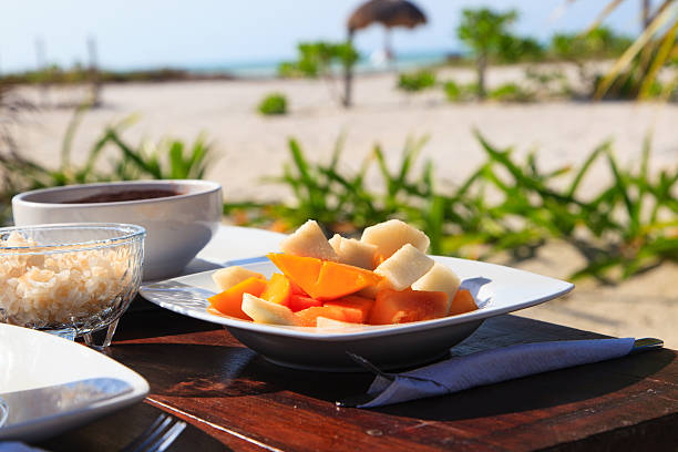 istock fruit salad and soup served on the beach 518117936