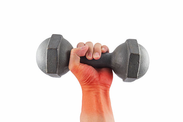istock Pain wrist with dumbbell 518118072