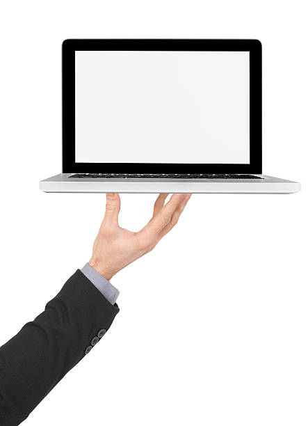 istock Holding a laptop with blank screen 518118256