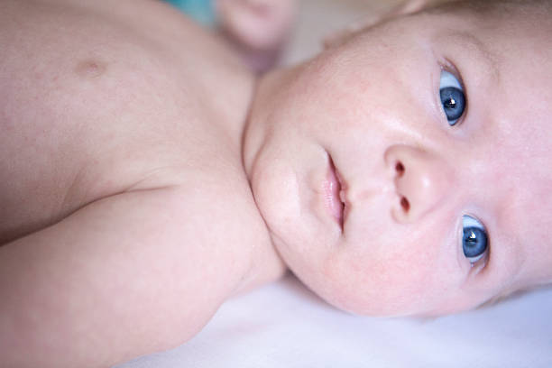 istock Two month old baby boy portrait on bed 518118436