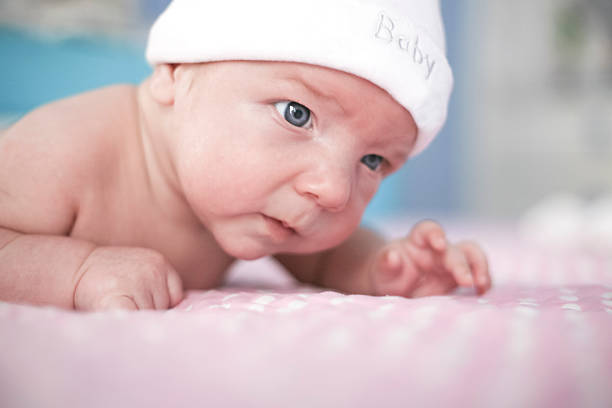 istock Two month old baby boy portrait on bed 518118532