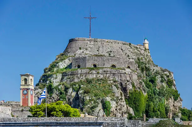 Venetian fort guarding old Corfu town with modern clock tower in the foreground