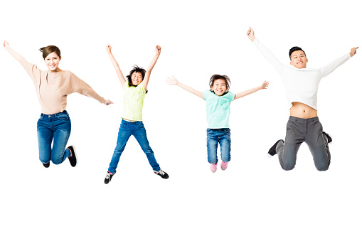 happy family jumping together isolated on white