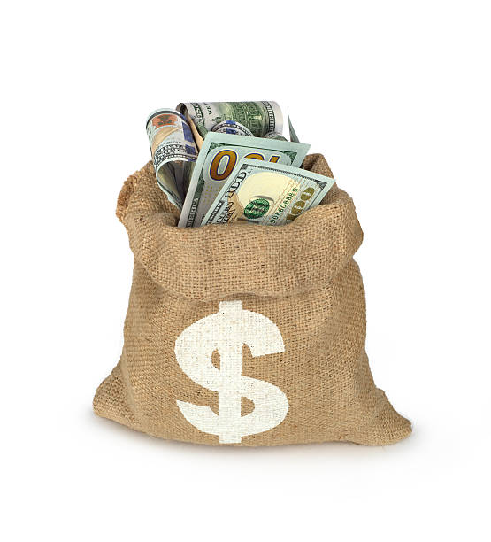 istock dollars bills in bag isolated on white, 518121786