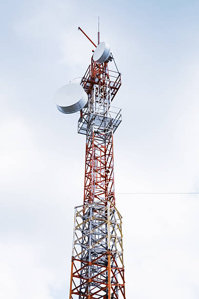 istock Telecommunication radio tower over cloudy sky 518122304