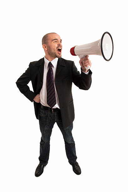istock Businessman Shouting Through Megaphone 518122440