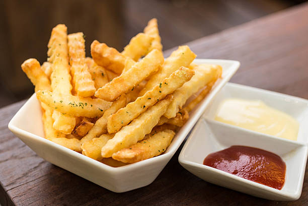 istock French fried in white bowl on wood table 518136718