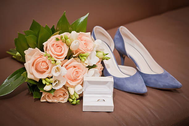 istock bridal bouquet, shoes, wedding ring in a box 518137502