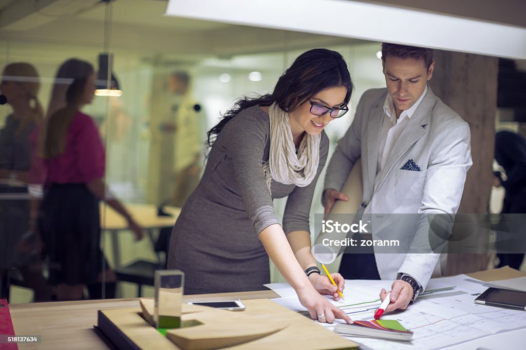 Interior designers choosing color Creative people choosing color from color swatches, background people Interior Designer Stock Photo