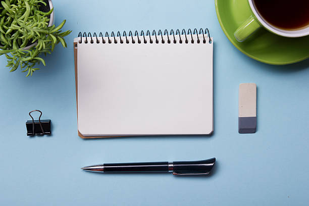 istock Office table with supply and coffe cup. View from above 518138342