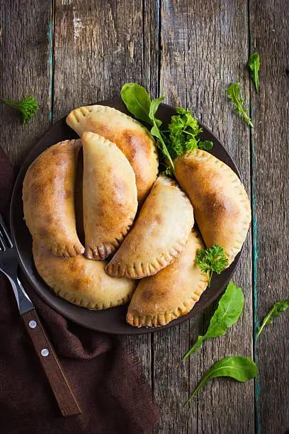 pasties filled with meat and vegetables, top view