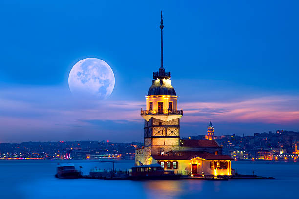 Maiden's Tower The Maiden's Tower (Turkish: Kız Kulesi), also known in the ancient Greek and medieval Byzantine periods as Leander's Tower (Tower of Leandros), sits on a small islet located at the southern entrance of Bosphorus strait 200 m (220 yd) off the coast of Üsküdar in Istanbul, Turkey. galata tower photos stock pictures, royalty-free photos & images