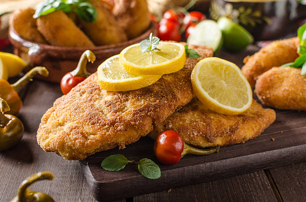 istock Chicken schnitzel with croquettes 518144696