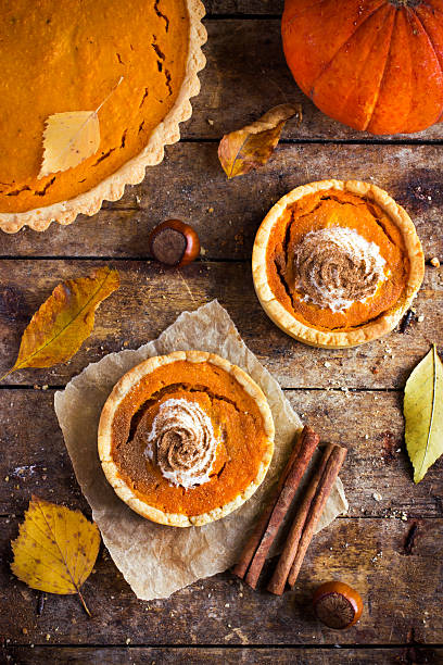 istock pumpkin tarts with whipped cream and cinnamon 518144810