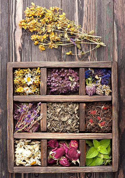 istock Dried Herbs and flowers in vintage box 518147555