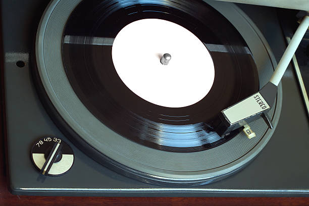 istock Vintage turntable with vinyl record top view closeup 518148486