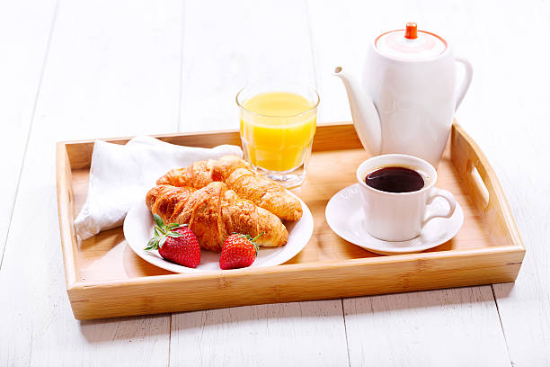 istock Breakfast with cup of coffee and croissants 518148692