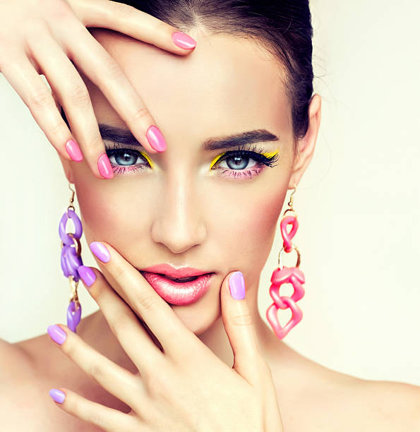 istock Girl model with bright make-up and coloured nail. Spring style. 518149732