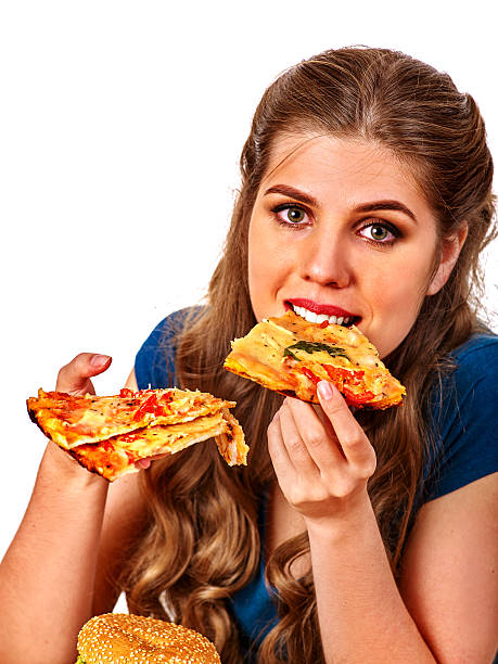 若い美しい女性のピザを食べる大きな - large cheese beautiful red ストックフォトと画像