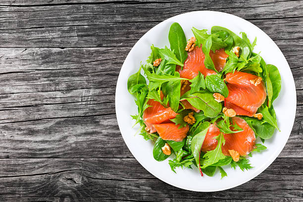istock Red fish healty salad on white dish 518150168
