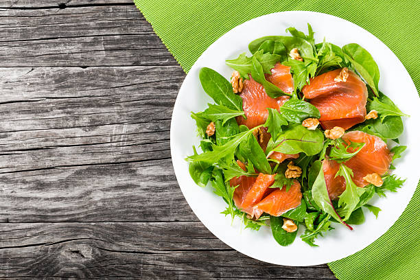 istock Red fish healty salad on white dish 518150634