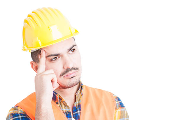 istock Close-up of thoughtful constructor with helmet and protection eq 518150714