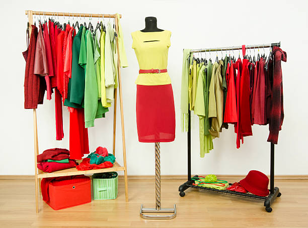 istock Dressing closet with complementary colors red and green clothes. 518151025