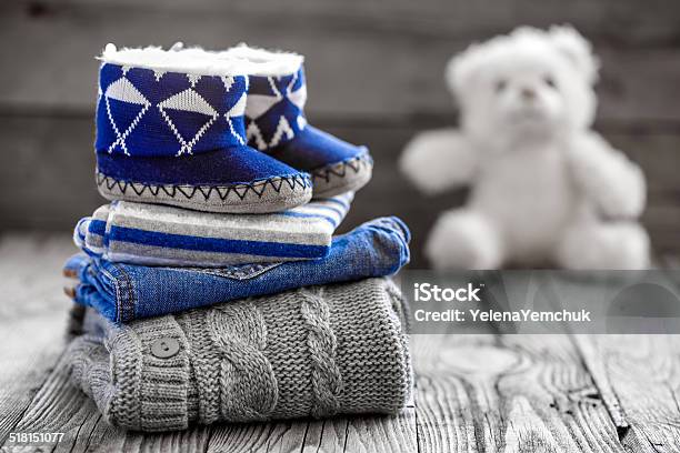 Baby Clothes Stock Photo - Download Image Now - Folded, Baby Booties, Babyhood