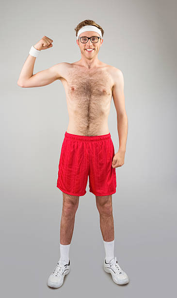 istock Geeky shirtless hipster flexing bicep 518151131
