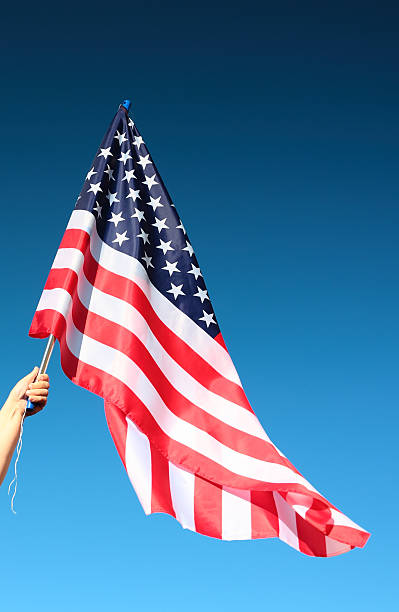 istock Hand holding american flag 518151139