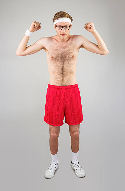 istock Geeky shirtless hipster flexing biceps 518151179