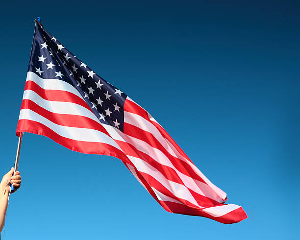 istock Hand holding american flag 518151341