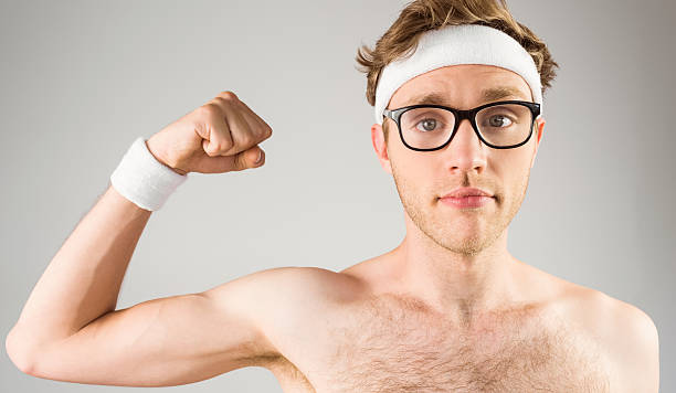istock Geeky shirtless hipster flexing bicep 518153539