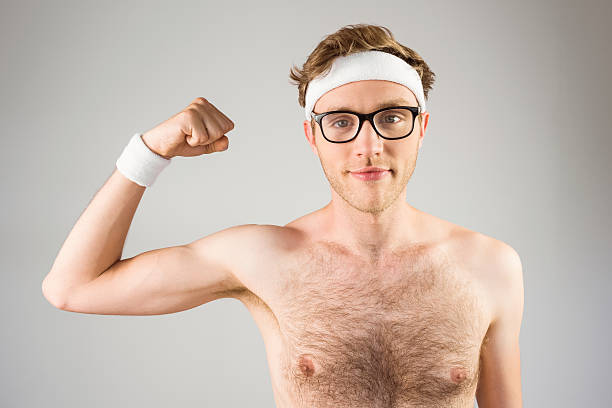 istock Geeky shirtless hipster flexing bicep 518153541
