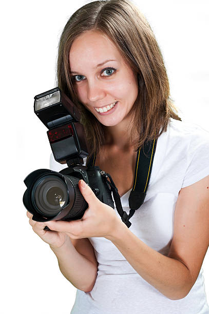 istock Cute girl with professional digital camera isolated on white background 518154823