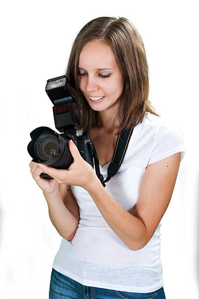 istock Student girl with professional digital camera isolated on white background 518154827