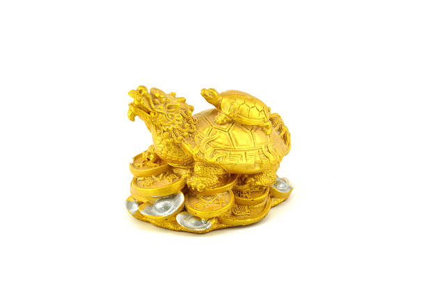 istock golden tortoise statues 518170475