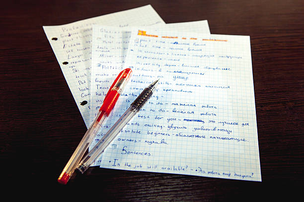 istock Paper from an exercise book and pens 518172600