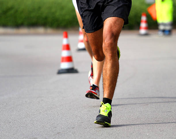 istock Marathoner runs fast for the paved road 518172685