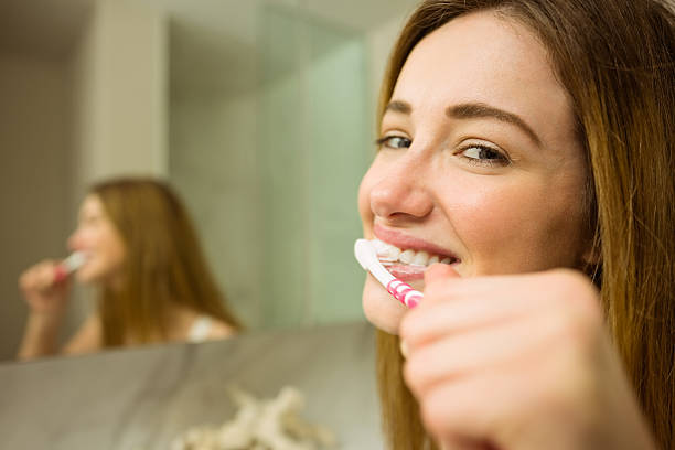 istock Cute couple brushing their teeth 518173403