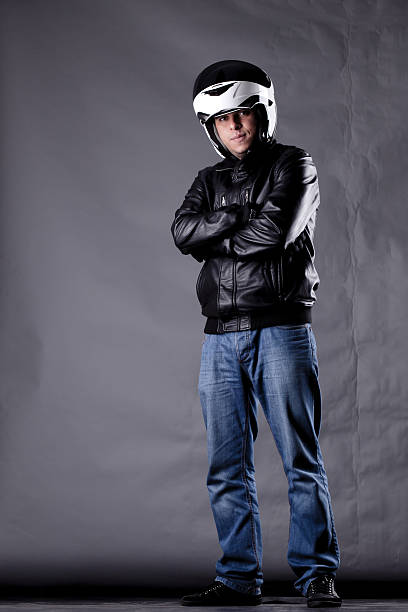 istock motorist with a helmet, leather jacket and jeans 518174442
