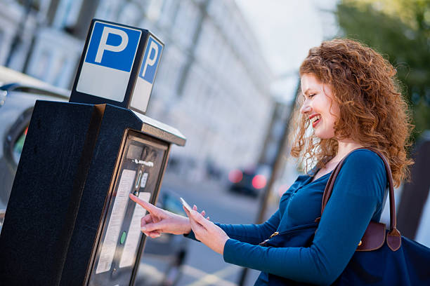 istock Woman Paying for Parking 518174899