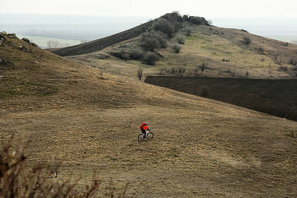 istock Man cyclist with backpack riding the bicycle 518175118