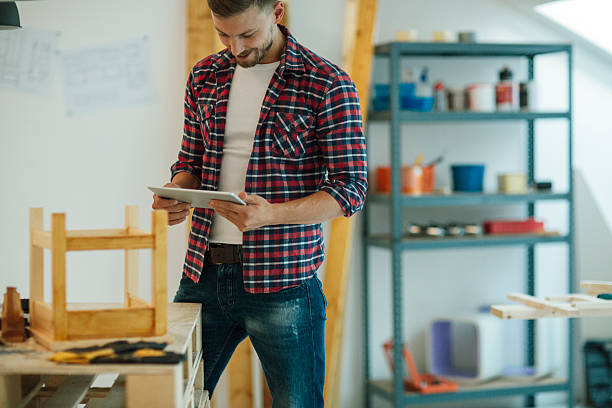 istock Designer Using Digital Tablet In His Furniture Workshop. 518175168