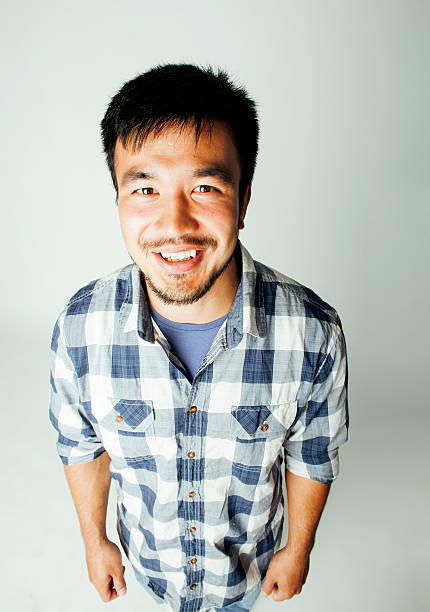 istock young cute asian man on white background gesturing emotional, pointing 518175178