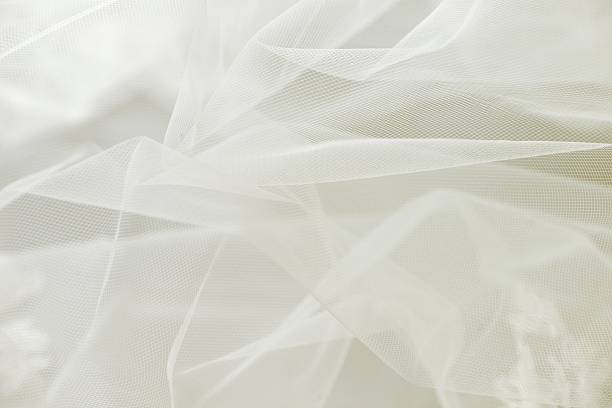 Wedding tulle or chiffon background Ivory wedding tulle or chiffon background chiffon stock pictures, royalty-free photos & images