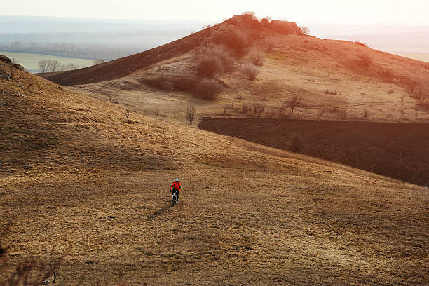 istock Man cyclist with backpack riding the bicycle 518175648