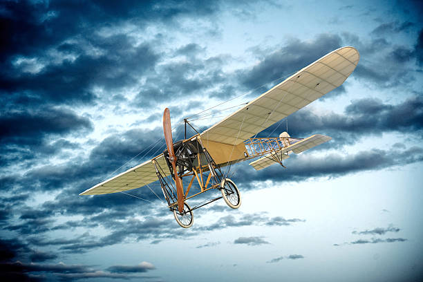 istock Old vintage mono plane flying in an evening sky 518175956