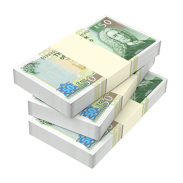 istock Stack of Scotland pound bills isolated on white background. 518176080